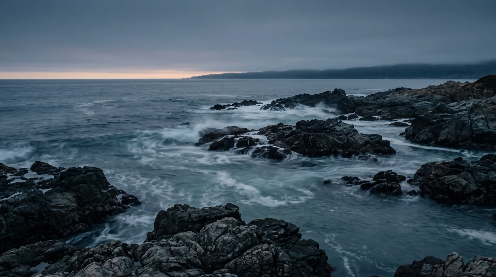 Waves meeting around dark rocks at dusk, cover image for the perpetual futures funding rates guide
